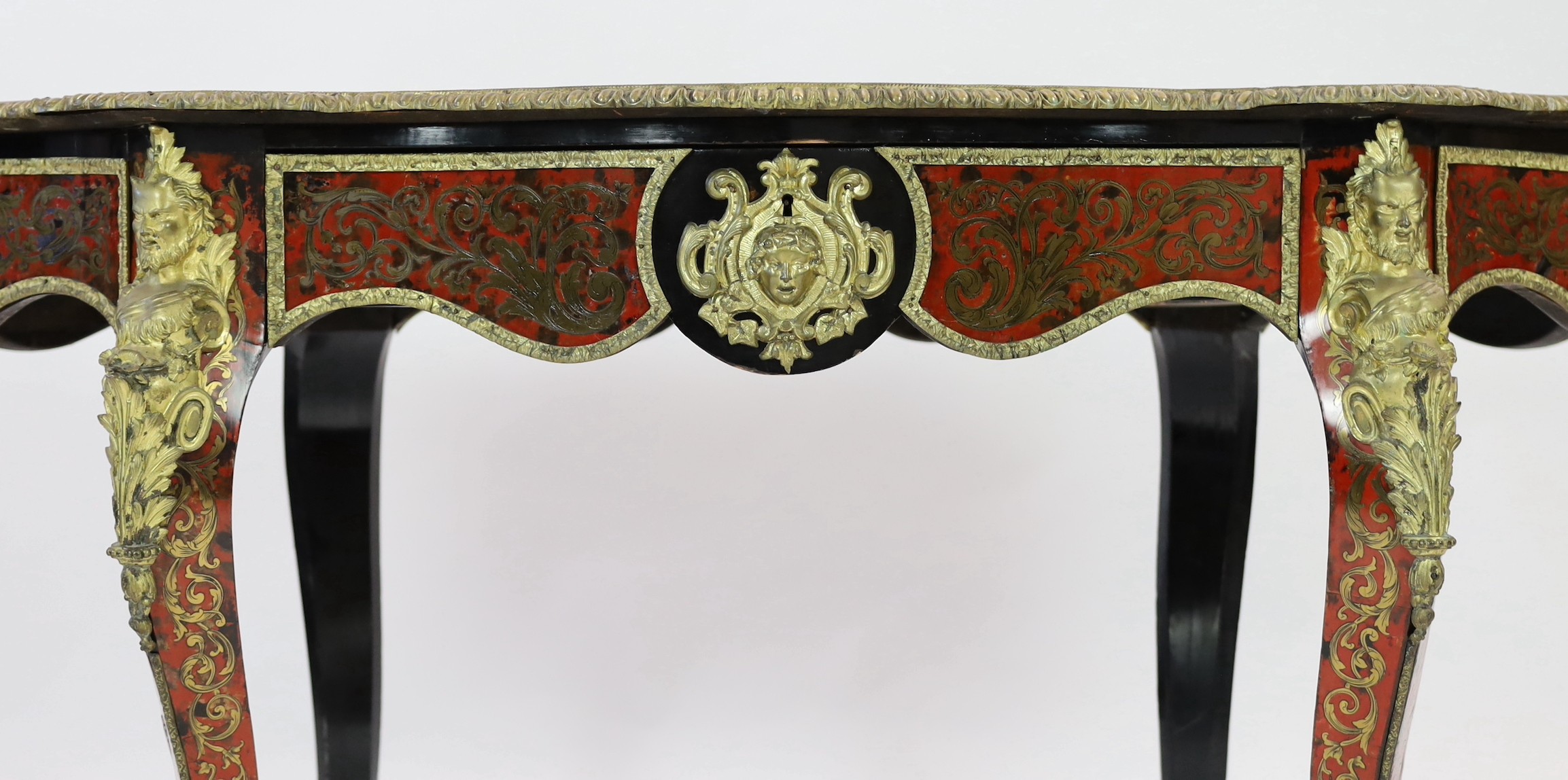 A 19th century French red boulle bureau plat, width 147cm depth 88cm height 77cm